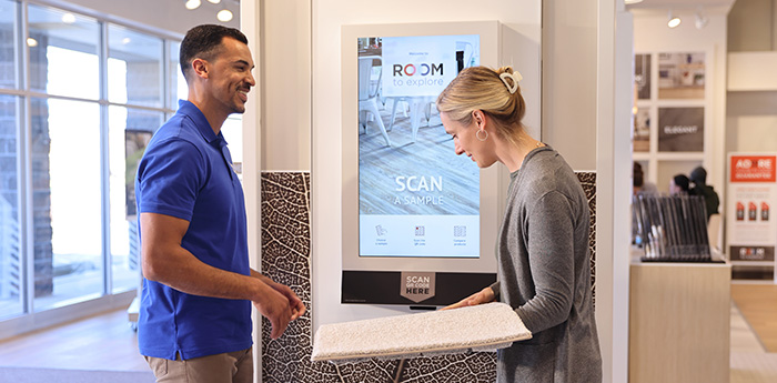 woman browsing carpet sample in showroom